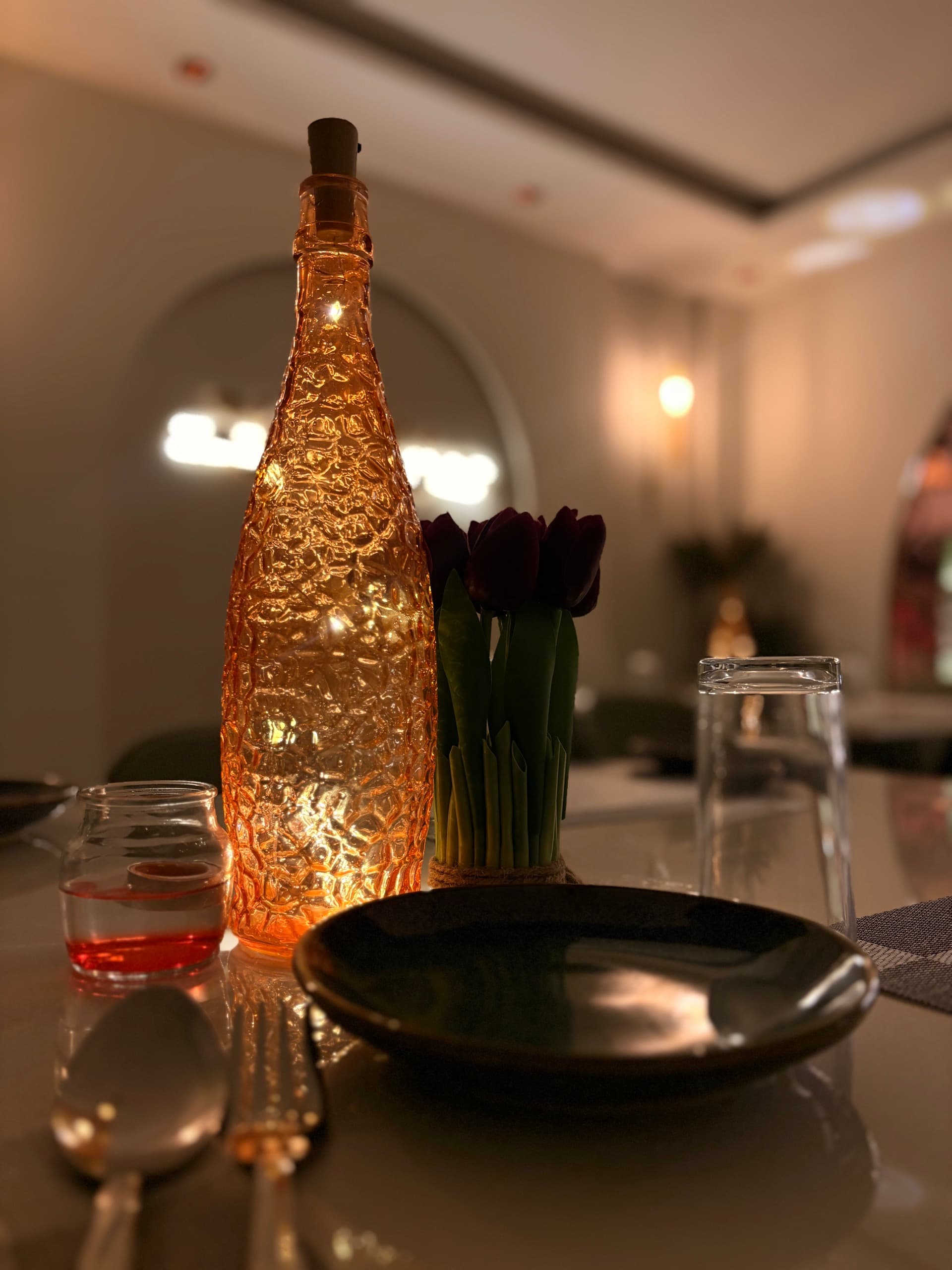 Dining table setup at Mangalam Hotel